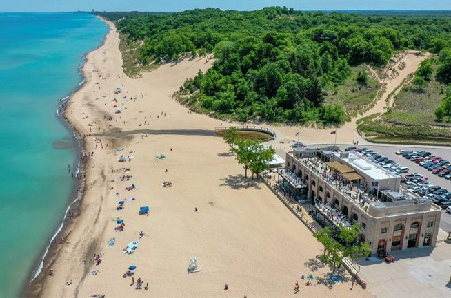 Aerial view of the historic pavilion, sandy beach and Lake Michigan at Indiana Dunes State Park