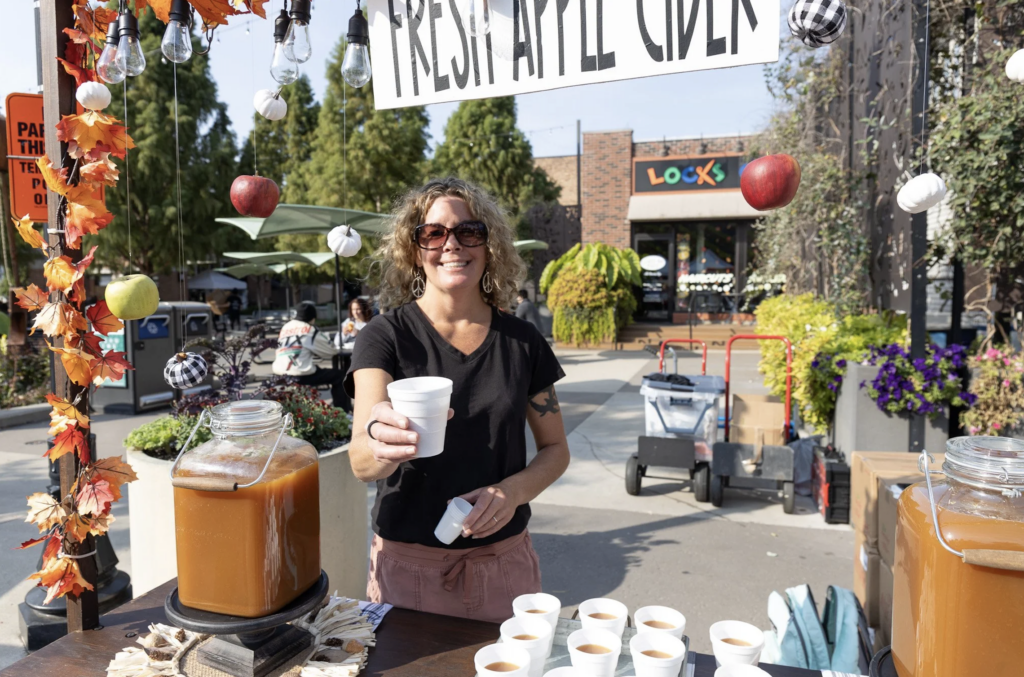 Apple cider being served during a fall festival in downtown Valparaiso, Indiana.
