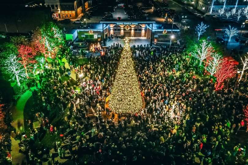 Aerial view of a large crowd gathered around an illuminated Christmas tree during Valparaiso’s Winter Fest and Tree Lighting at Central Park Plaza, surrounded by colorful holiday lights.